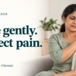 A woman gently holding her shoulder while exploring the importance of gentle movement during frozen shoulder treatment.